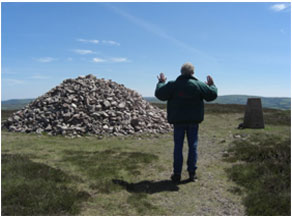 Praying on Holdstone Down Camino Devon UK
